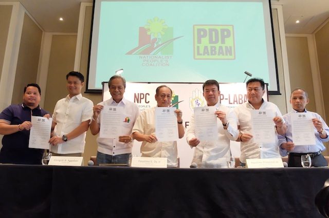 PDP-LABAN AND NPC COALITION AGREEMENT. Officials of PDP-Laban and the Nationalist People's Coalition hold up their coalition agreement on May 20, 2016. Photo by Alecs Ongcal/Rappler 