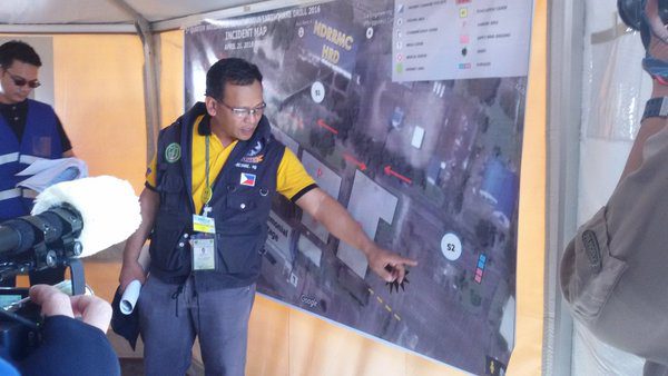 SITREP. A member of the incident command post team briefs media on the #Pagyanig situation. Image courtesy abegail Llamazares / Rappler 