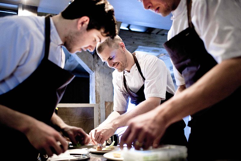 TEAMWORK. Three cooks work in the kitchen of Noma Restaurant in Copenhagen, Denmark, 27 April 2010. Danish restaurant Noma has topped the World’s 50 Best Restauarants list this 2014. Photo by Nikolai Linares/Demark Out/EPA