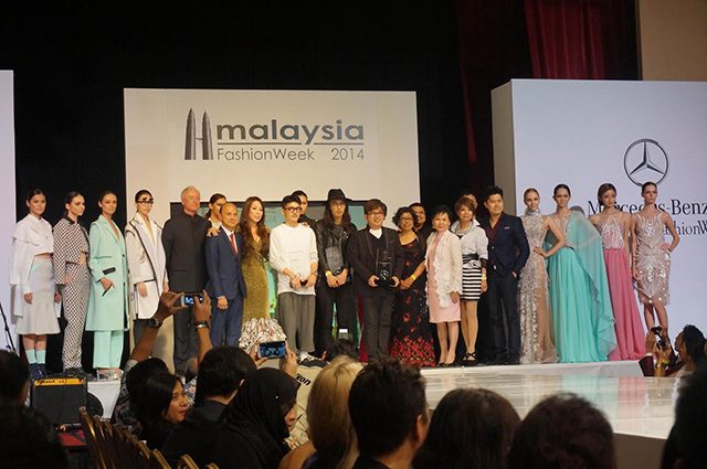 WINNERS. The awardees pose with designer Jimmy Choo, the organizers of the event, and the models wearing their creations
