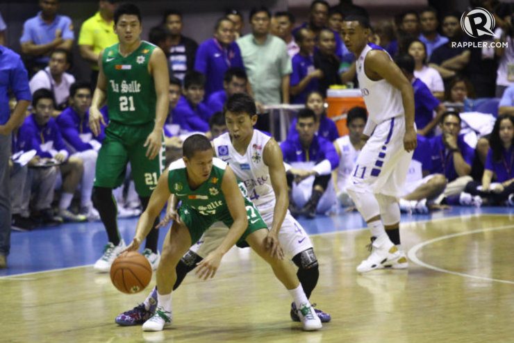 Almond Vosotros of La Salle dribbles as Ateneo's Nico Elorde tries to defend