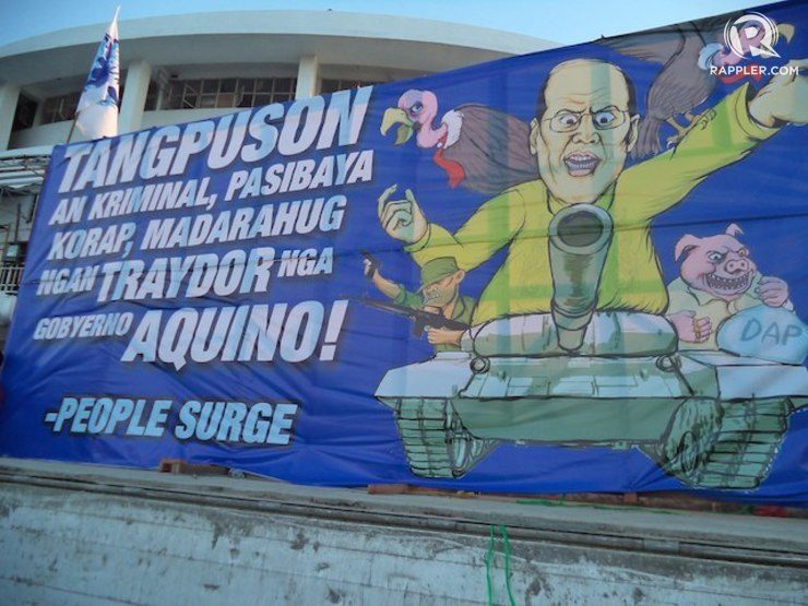 'PEOPLE SURGE.' A poster used by Tacloban protestors against the Aquino administration's slow action on rehabilitation efforts in the province. Photo by Fritzie Rodriguez/Rappler