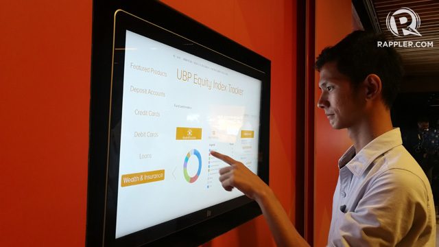 NEW INTERFACE. A look at how customers process transactions at UnionBank's new Ark digital bank branch. file Photo/rappler  