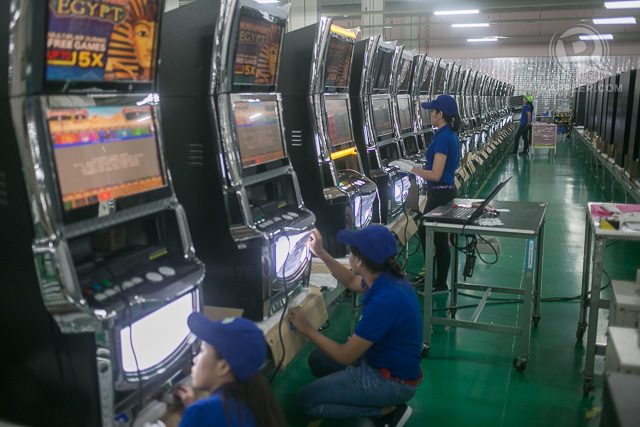 PRODUCING. Workers at the facility working on its staple product, slot machines. The facility shipped out 4,500 units in 2014.  