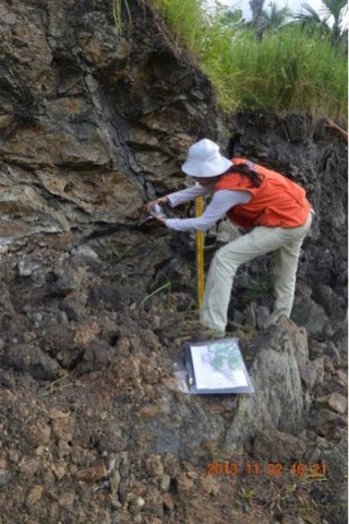 FAULT FINDERS. A Phivolcs geologist measures strike and dip of the North Bohol Fault. Photo from Phivolcs  