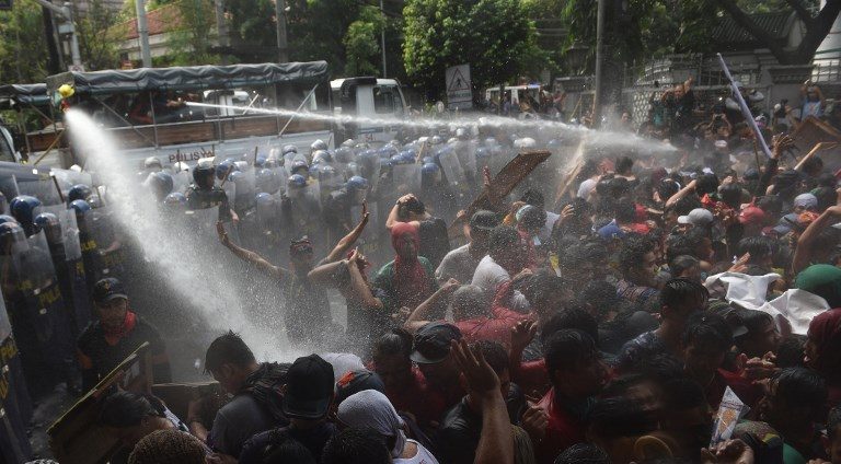 WATER CANNONS. Riot policemen use water cannons on protesters trying to march to the ASEAN Summit venue during the 31st Association of South East Asian Nations (ASEAN) Summit in Manila on November 13, 2017. Photo by Ted Aljibe/AFP 
