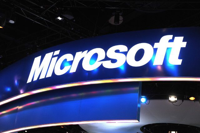 Reorganization costs hit Microsoft profit