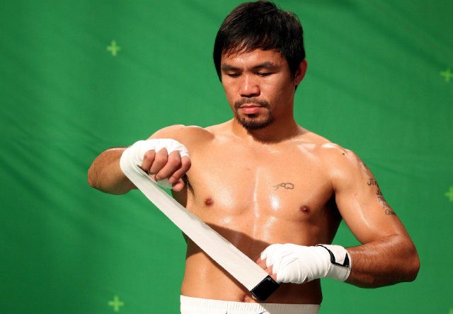Manny Pacquiao wraps his hands. Photo by Chris Farina - Top Rank 