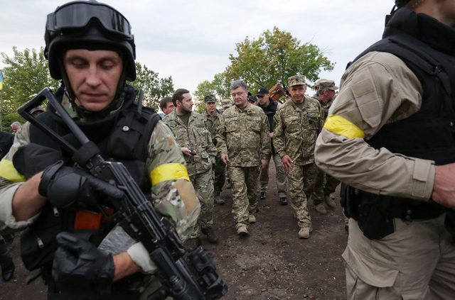 Ukraine vows to strike back after rebels kill 23 troops