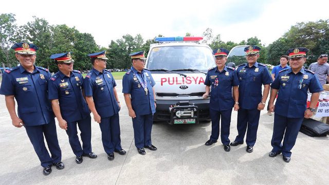 NEW EQUIPMENT. Purisima also turns over a new vehicle, assault riffles, ammunition, and cash assistance. Photo courtesy of the PNP PIO