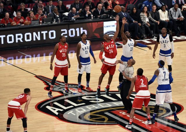 TIP-OFF. Kobe Bryant (C-L) goes for the ball against LeBron James (C-R) in the 2016 NBA All-Star Game at the Air Canada Center in Toronto, Ontario, Canada. Photo by Warren Toda/EPA  