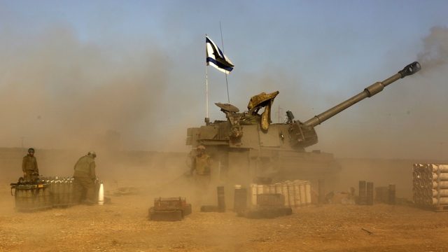 OPERATION. Israeli artillery positioned at the Israeli border with Gaza, shell toward targets in the Gaza Strip, 12 July 2014. Israel moved three infantry brigades closer to the coastal enclave in preparation for a possible ground offensive. Photo by Atef Safadi / AFP