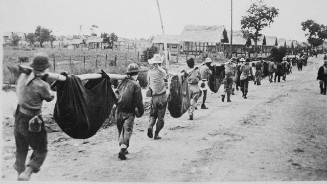 After the Bataan Death March, Allied prisoners of war carry their comrades in slings, depicting what appears to be a burial detail. File Photo from Wikimedia Commons