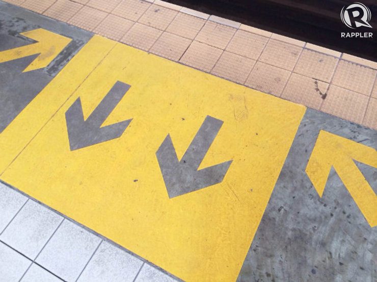 FOLLOW THE LINES. You might see these lines along the MRT's platform edge. Please, follow them. Photo by Jane Bracher/Rappler