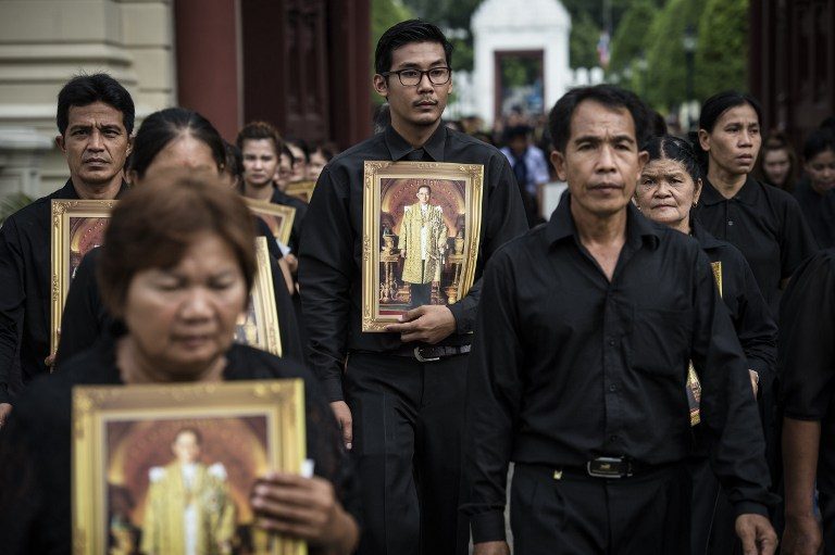Tens of thousands queue to pay respects to late Thai king