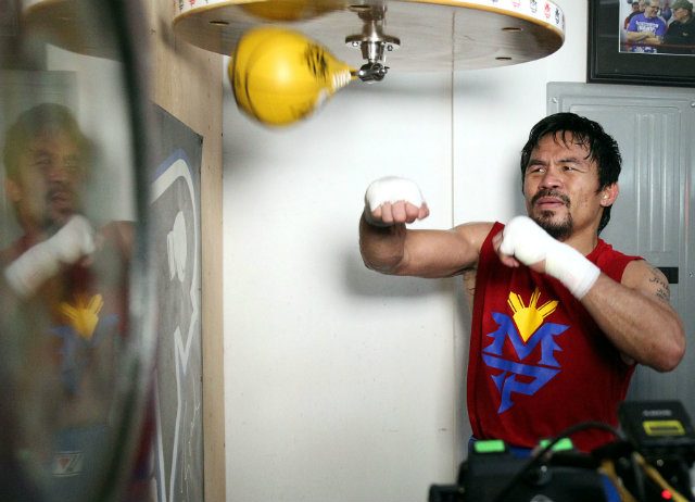 Manny Pacquiao works the speed bag. Photo by Chris Farina - Top Rank 