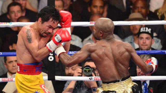 FIGHT OF THE CENTURY. Floyd Mayweather Jr lands a left on Manny Pacquiao during his unanimous decision victory. Photo by Frederic J Brown/AFP   