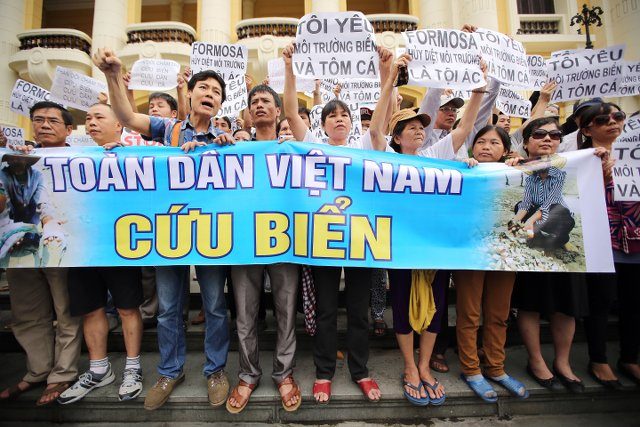 Vietnam breaks up protests as anger seethes over fish deaths