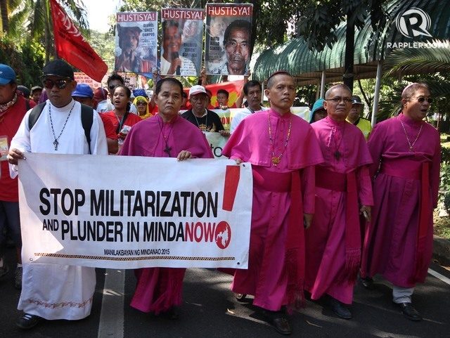 PULL OUT OF MINDANAO. Members of the Mindanao Bishops' Conference lead the march to the Mines and Geosciences Bureau. 