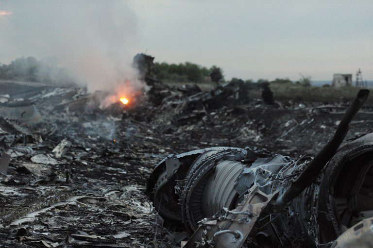 A picture taken on July 17, 2014 shows wreckages of the malaysian airliner carrying 295 people from Amsterdam to Kuala Lumpur after it crashed, near the town of Shaktarsk, in rebel-held east Ukraine. Photo by Dominique Faget/AFP 