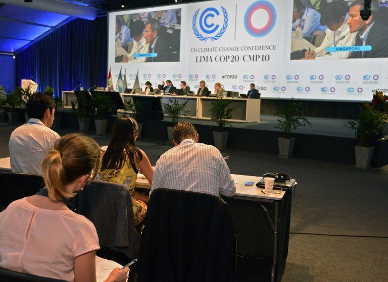 CLIMATE TALKS. Members of representative commissions of the countries participating in the climate change conferences, attend the seventh plenary meeting of the COP20 on December 13, 2014 in Lima. Cris Bouroncle/AFP
