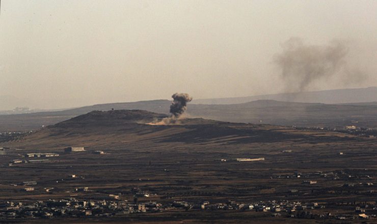 Smoke rises from an explosion an a Syrian village along the border with Israel during fighting between forces loyal to Syrian President Bashar Al-Assad and Syrian rebel fighters. EPA/ATEF SAFADI