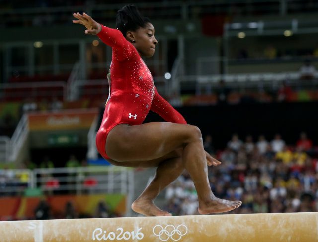 Biles loses balance as Olympic gold record eludes American gymnast