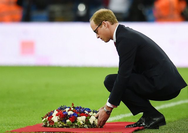 Prince William, the Duke of Cambridge, lays a wreath prior the France versus England match at Wembley Stadium. Photo by ANDY RAIN/EPA  