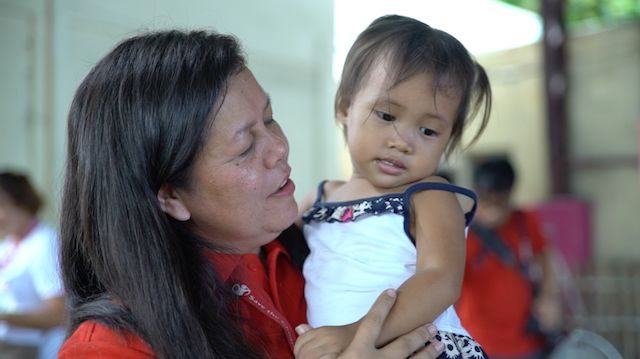 MOTHERHOOD. Even if she's never had a child, Erlinor Umali feels she's a mother to the children she helps as a development worker.  