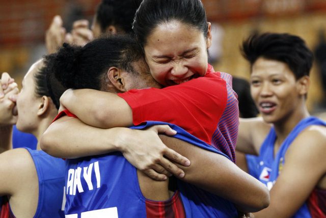 Raiza Rose Dy and Merenciana Arayi embrace after pulling off the upset. Photo from FIBA.com 