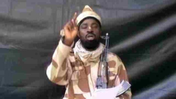 A grab made on July 13, 2013 from a video obtained by AFP shows the leader of the Islamist extremist group Boko Haram Abubakar Shekau, dressed in camouflage and holding an Kalashnikov AK-47. AFP PHOTO/BOKO HARAM
