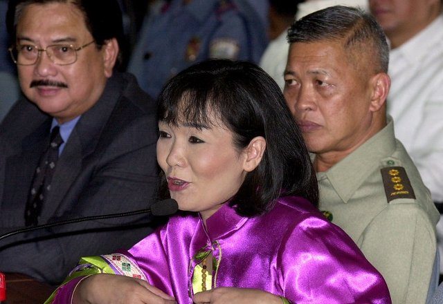 WITNESS. Undercover agent Mary Grace 'Rosebud' Ong and military intelligence Chief Col. Victor Corpus testify in the 2001 Senate probe. AFP file photo  