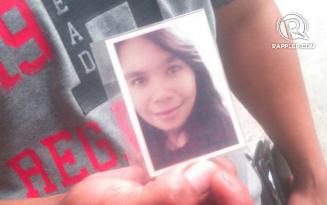 SISTER. Ammied Rada shows a photo of his 21-year-old sister Gerly, who died in the May 13 factory fire. Photo by Buena Bernal/Rappler 