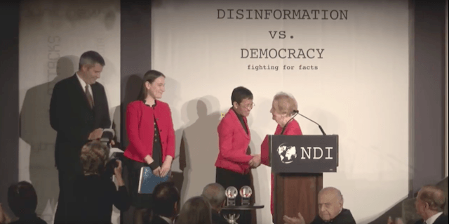 DEMOCRACY AWARD. Rappler CEO and Executive Editor Maria Ressa shakes hands with National Democratic Institute chair Madeleine Albright, the 64th US secretary of state, the first woman to become America's top diplomat. Screenshot from NDI  