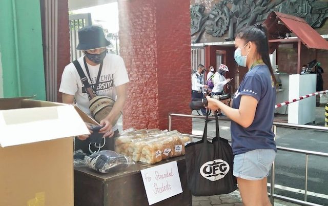HELP. A stranded students gets food and a face mask from a Sagip Kabataan volunteer. Photo from Youth for Nationalism and Democracy-Philippines Facebook page 