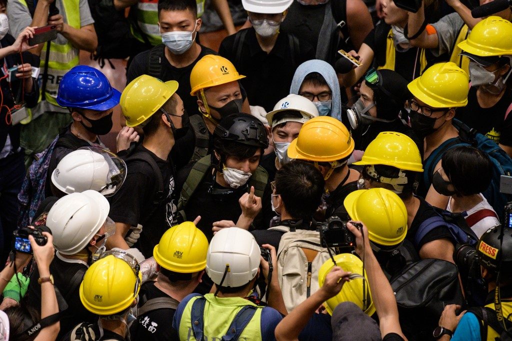Hand signals and shields: how Hong Kong’s parliament was stormed