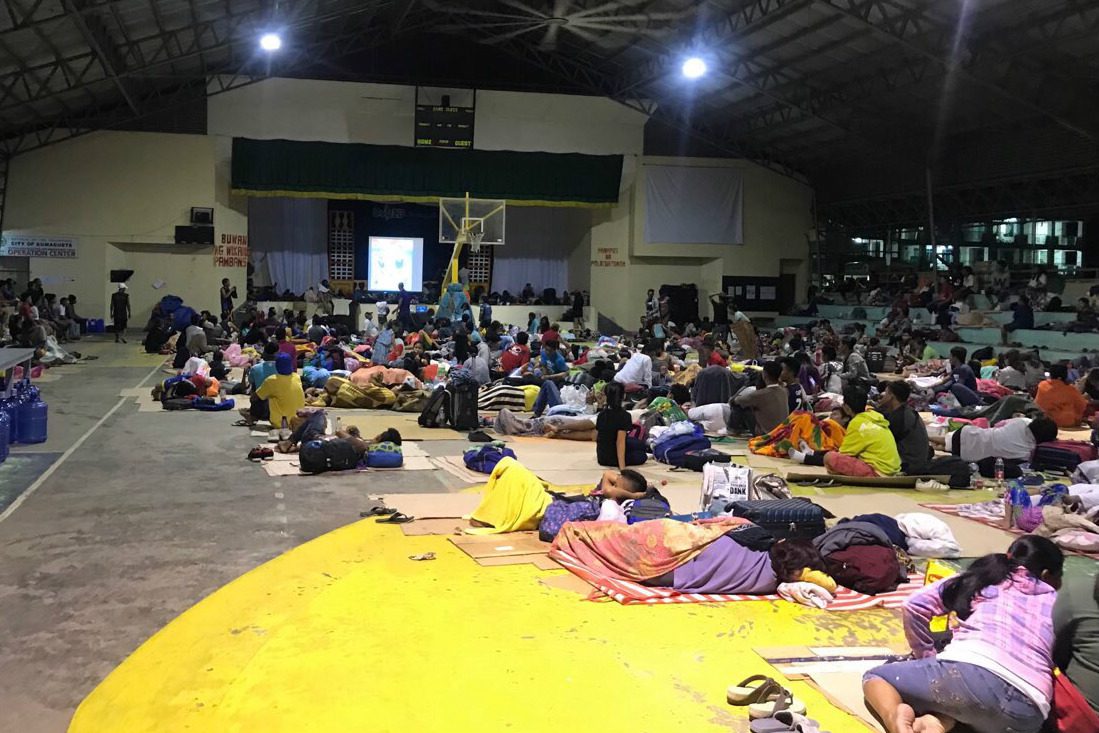 DFA giving P5,000 aid for OFWs stranded due to Typhoon Ompong