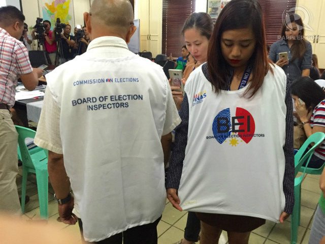 P26.5-MILLION DEAL. The Comelec will require teachers serving in the elections to wear these 'bib vest' uniforms in the May 9 polls. The Comelec is buying thousands of these for a total cost of P26.5 million. Photo by Paterno Esmaquel II/Rappler   