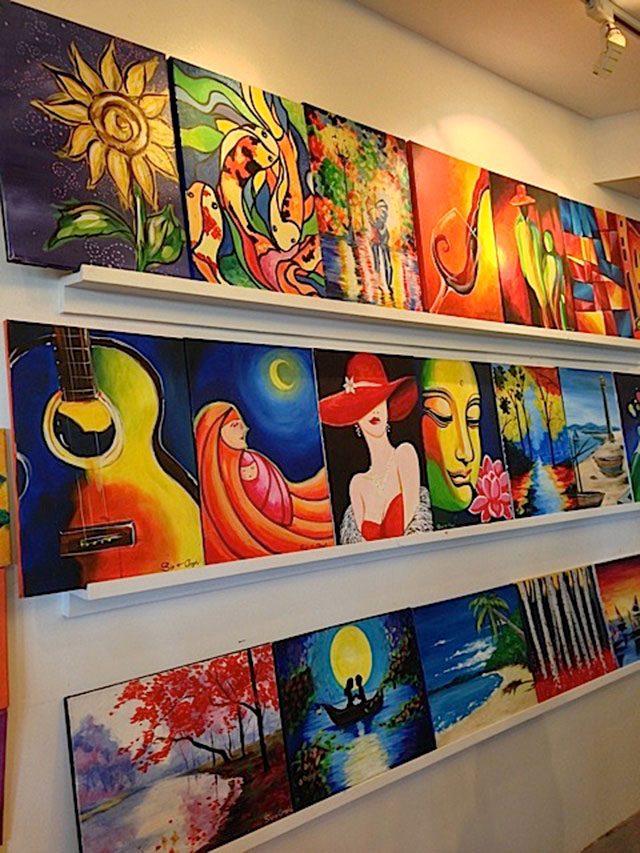 DECOR. Colorful artwork lines the walls 