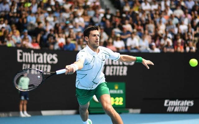 Rampant Djokovic sets up Raonic quarterfinal
