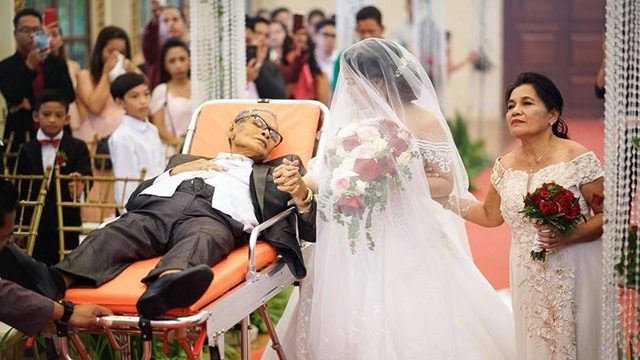 Father who walked daughter down the aisle in viral photo, passes away