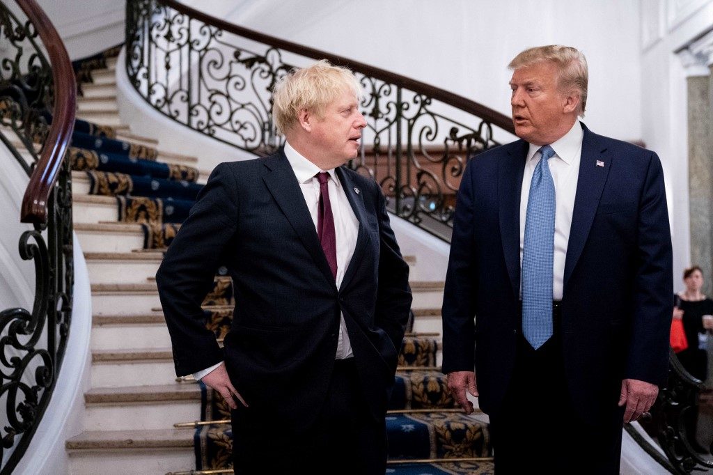 Trump backs Johnson, sends mixed signals on China at G7