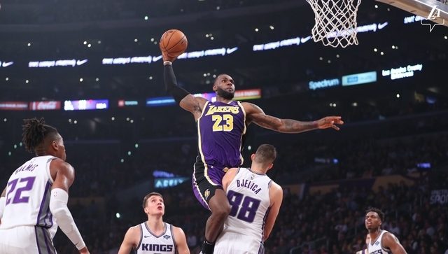 Lakers escape Kings for solo lead in West behind James, Davis