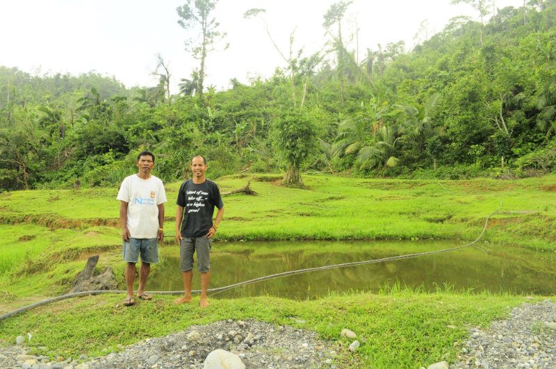 MANGYAN ALANGAN CULTURE. Domingo Torres and Vicente Sara stand on land where the balaylakoy will be constructed.  