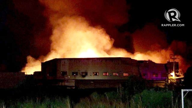 CAVITE EPZA'S BIGGEST EMPLOYER. Fire hits the Housing Technology Industries facility in Cavite's Export Processing Zone at around 6 pm on February 1, 2017, just after employees have changed shifts. Rappler photo 