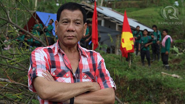 LEFT-LEANING? Davao City vice-mayor Rodrigo Duterte poses in front of an NPA camp in Compostela Valley. File photo by Karlos Manlupig. 