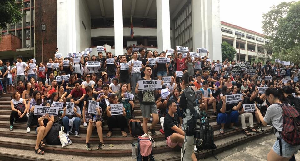 UP REMEMBERS. Students of the University of the Philippines protest in Palma Hall against the secret burial of Ferdinand Marcos. Photo by Katrina Artiaga/ Rappler  