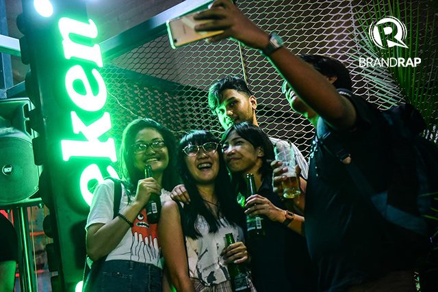 A PARTY TO REMEMBER. Barkadas take selfies at the sideline of the Open Manila party. Photo by Alecs Ongcal/Rappler 