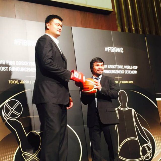 Manny Pacquiao holds a basketball while Yao Ming wears a boxing glove during the FIBA World Cup press conference. Photo from Patricia Hizon's Twitter account 