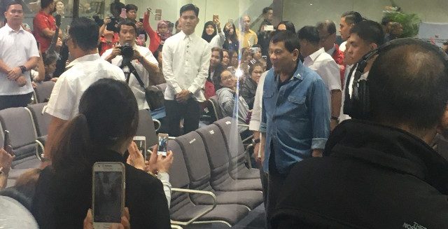 Duterte welcomes home over 100 OFWs from Kuwait